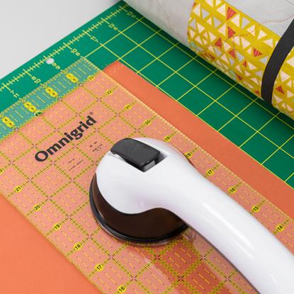 Omnigrid accessories include templates, storage, needles, gripping and taping.